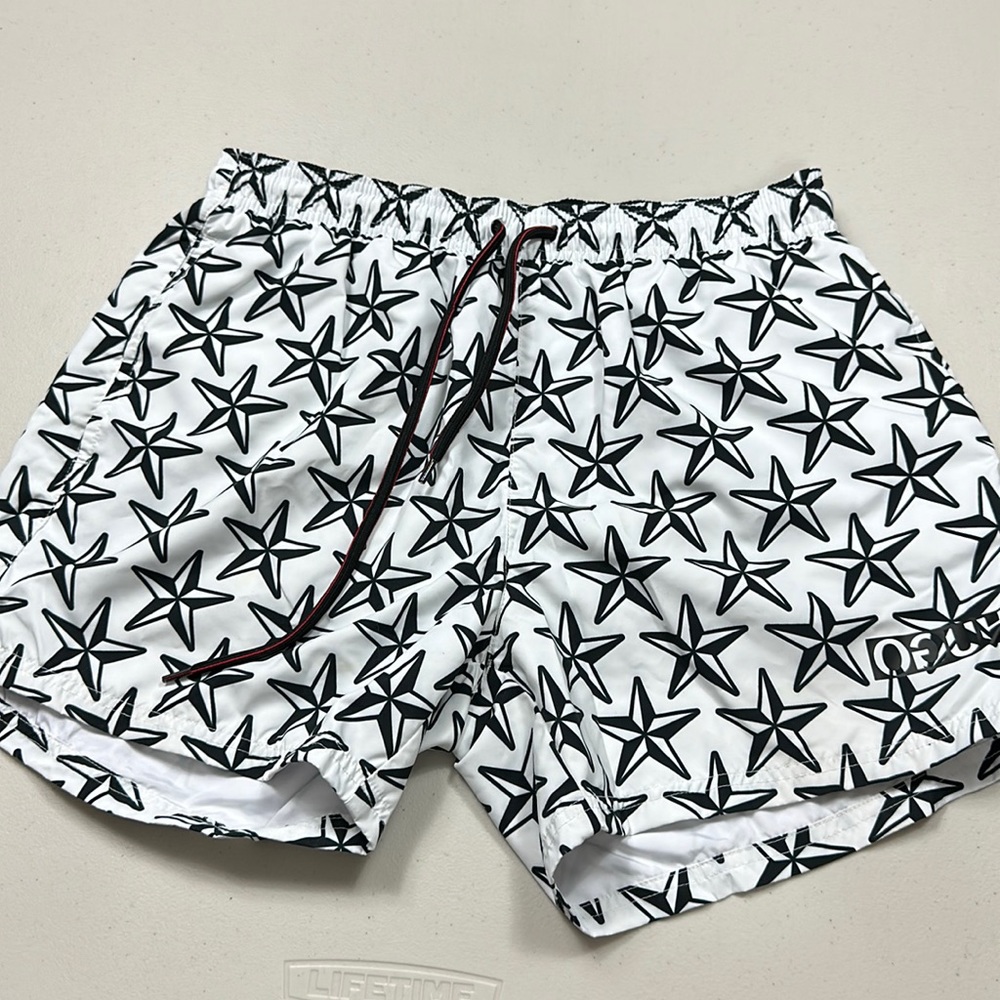 Hugo Boss men’s swim trunks in white and black stars